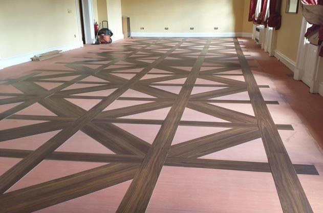 During installation - LVT pattern installation in progress.
